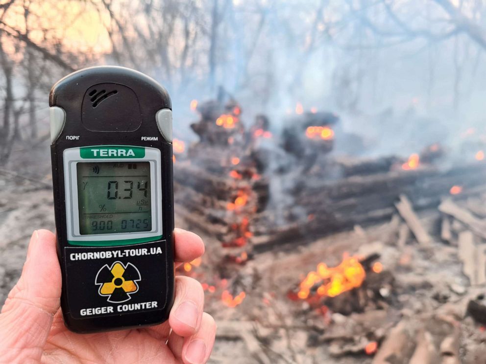 PHOTO: A Geiger counter measures a radiation level at a site of fire burning in the exclusion zone around the Chernobyl nuclear power plant, outside the village of Rahivka, Ukraine, April 5, 2020.