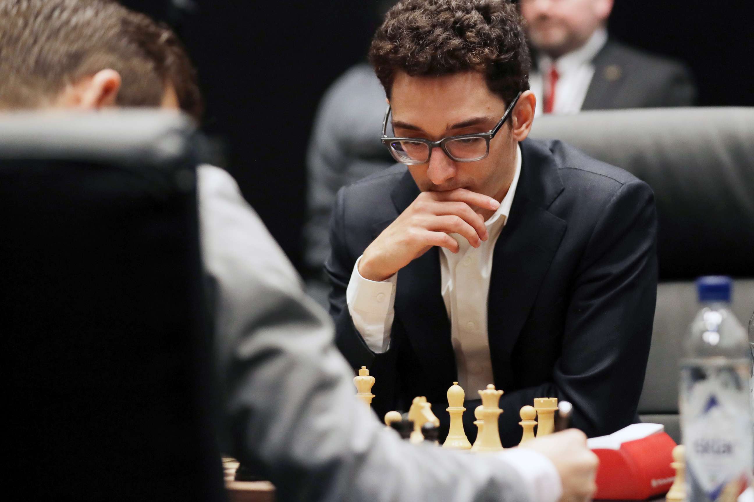 PHOTO: Italian-American challenger Fabiano Caruana plays reigning chess world champion Magnus Carlsen, left, from Norway, in the first few minutes of round 12 of their World Chess Championship Match in London, Nov. 26, 2018.