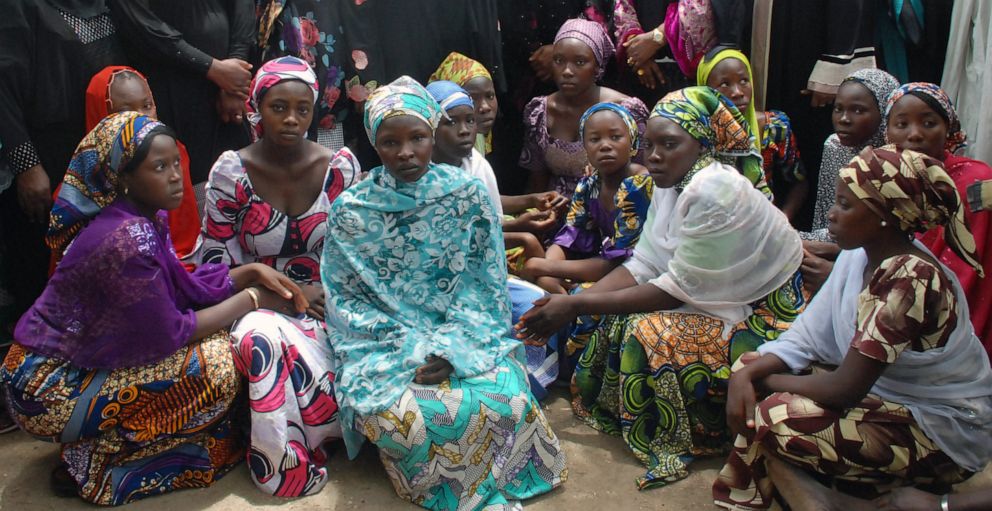 PHOTO: In this May 5, 2014 file photo, Chibok schoolgirls who escaped from Boko Haram militants gather to receive information from officials in northeast Nigeria.