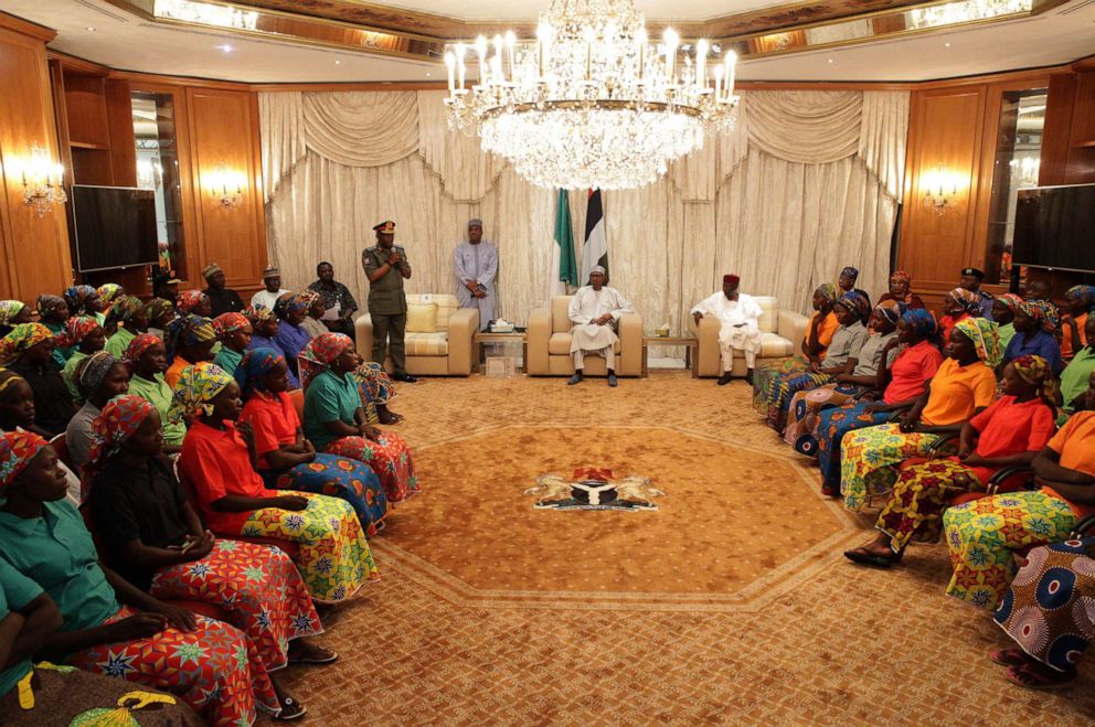 PHOTO: Relatives of abducted girls meet with President of Nigeria Muhammadu Buhari (C) after the releasing 82 of school girls, kidnapped by Boko Haram in Chibok back in 2014, at Aso Rock Presidential Villa in Abuja, Nigeria on May 7, 2017.