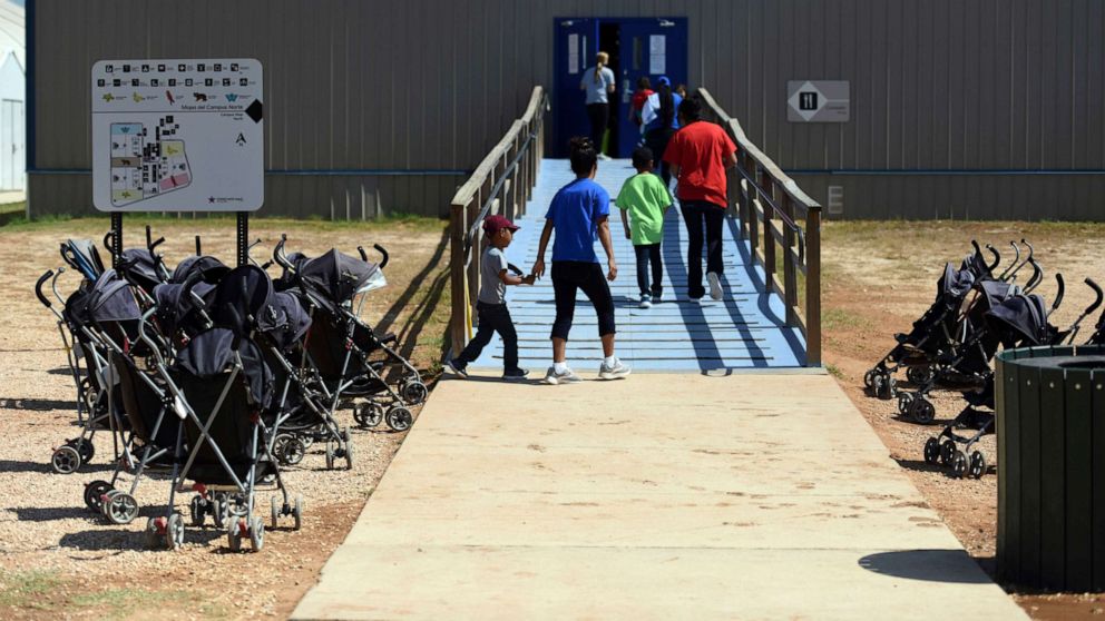 PHOTO: In this Aug. 9, 2018, file photo, provided by U.S. Immigration and Customs Enforcement, immigrants walk into a building at South Texas Family Residential Center in Dilley, Texas.