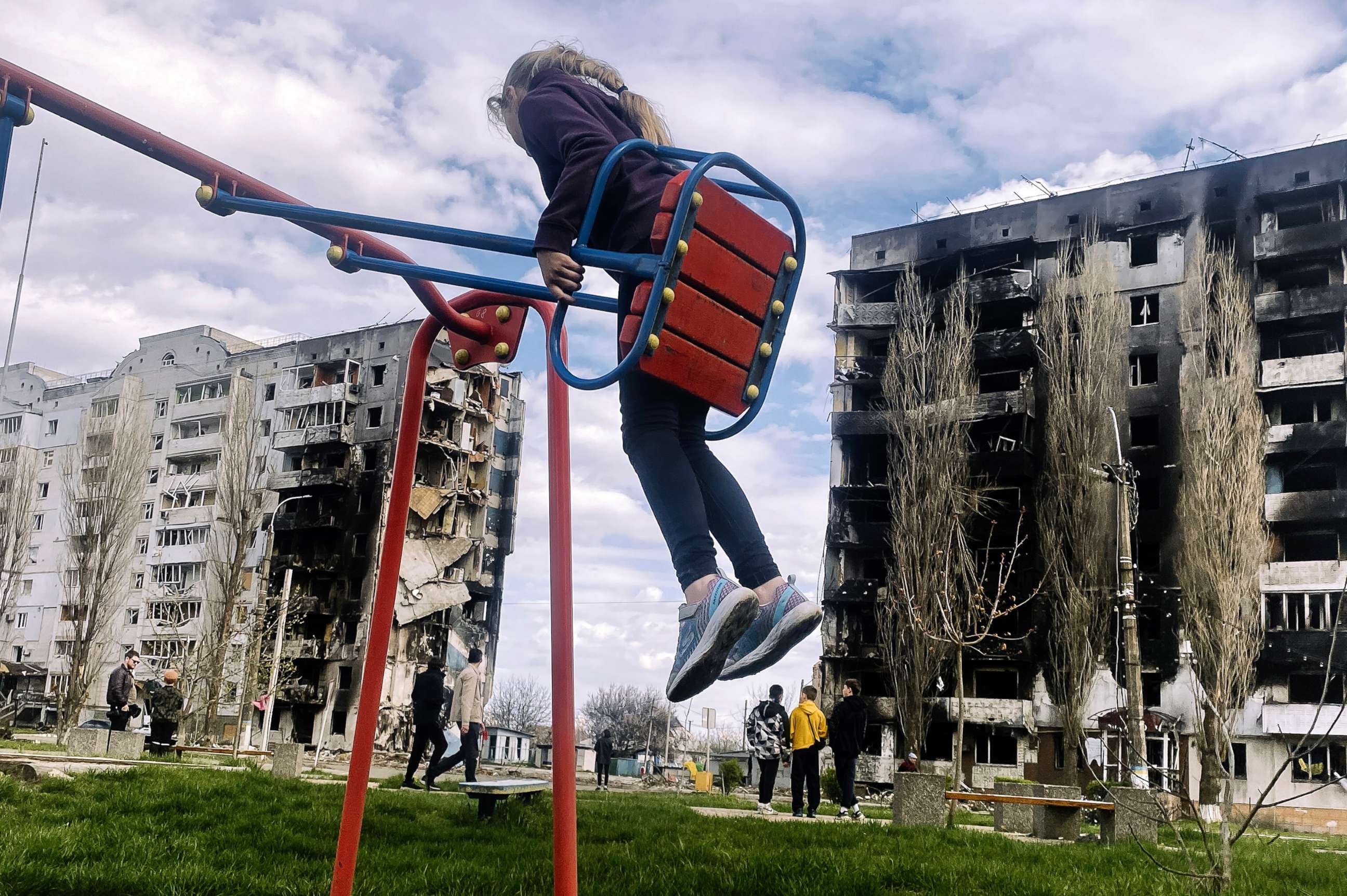 PHOTO: A child plays on a swing in the town of Borodyanka in Kyiv region, Ukraine. 
