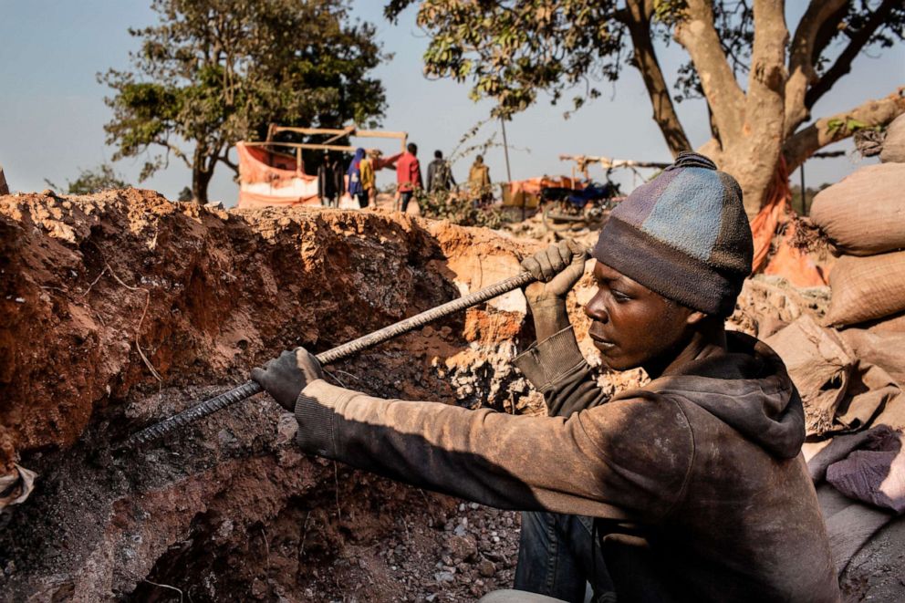 PHOTO: An undated photo shows a young miner digging for cobalt inside the CDM (Congo DongFang International Mining) Kasulo mine in Kolwezi, D.R.C.