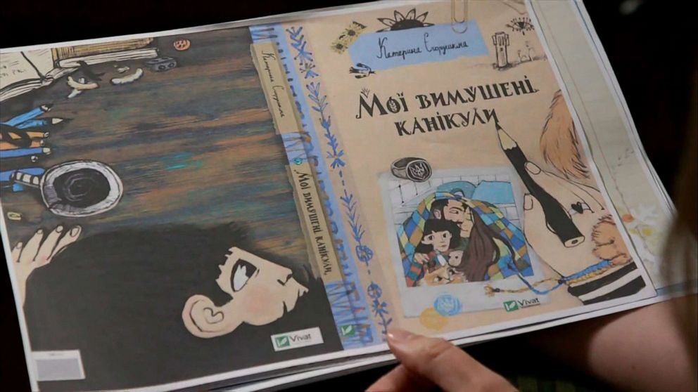 PHOTO: Children's book author Kateryna Yehorushkina shows a page from the book manuscript.