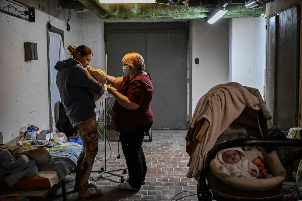 PHOTO: A nurse checks a baby being treated at a pediatrics center after the unit was moved to the basement of the hospital which is being used as a bomb shelter, in Kyiv on Feb. 28, 2022.