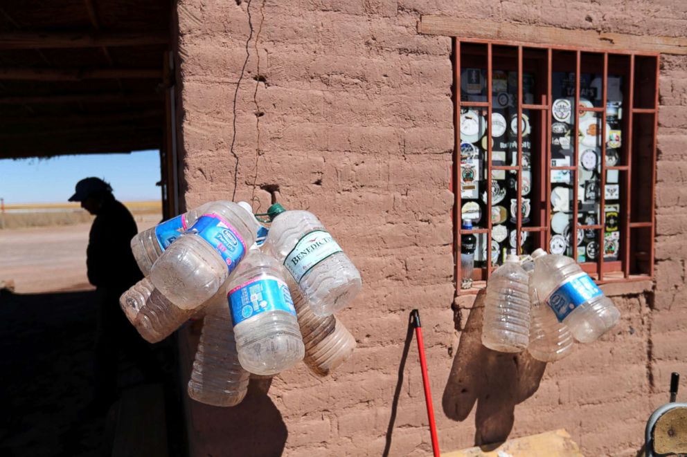 PHOTO: Empty water containers hang outside a mud house of a park ranger at Cejar lagoon at Atacama salt flat near San Pedro de Atacama, Chile, Aug. 15, 2018.