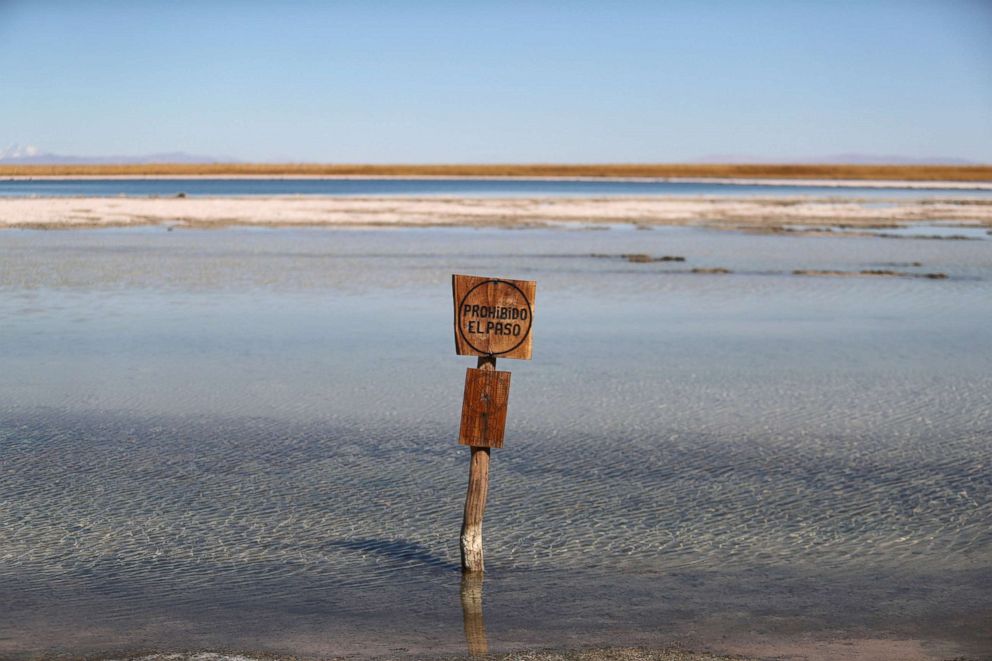 PHOTO: A sign reading 'No trespassing' stands at Cejar lagoon at Atacama salt flat near San Pedro de Atacama, Chile, Aug. 15, 2018.