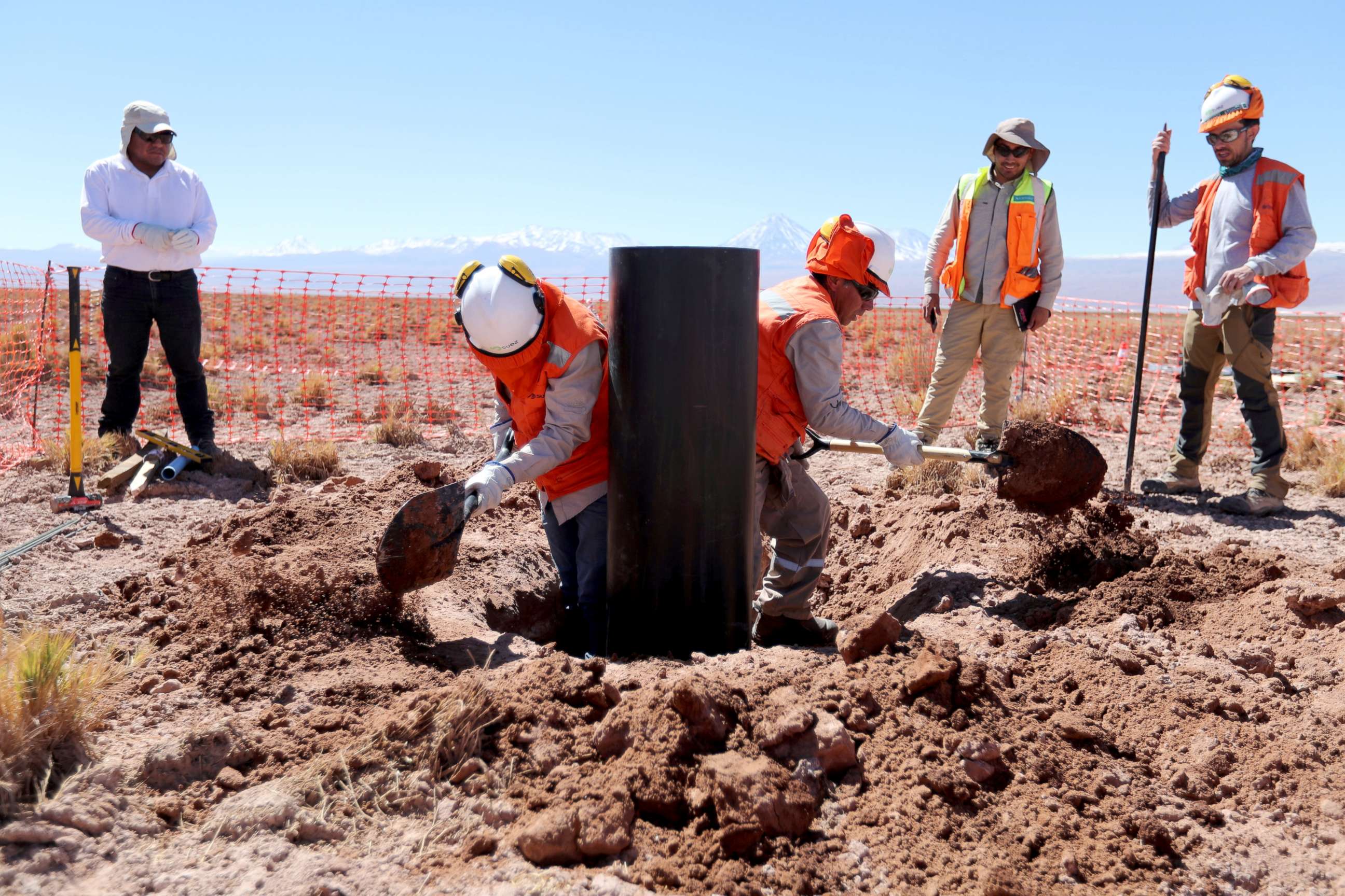 PHOTO: Workers prepare to install a moisture metering system in the middle of Atacama salt flat near Toconao in San Pedro de Atacama, Chile, Aug. 15, 2018.