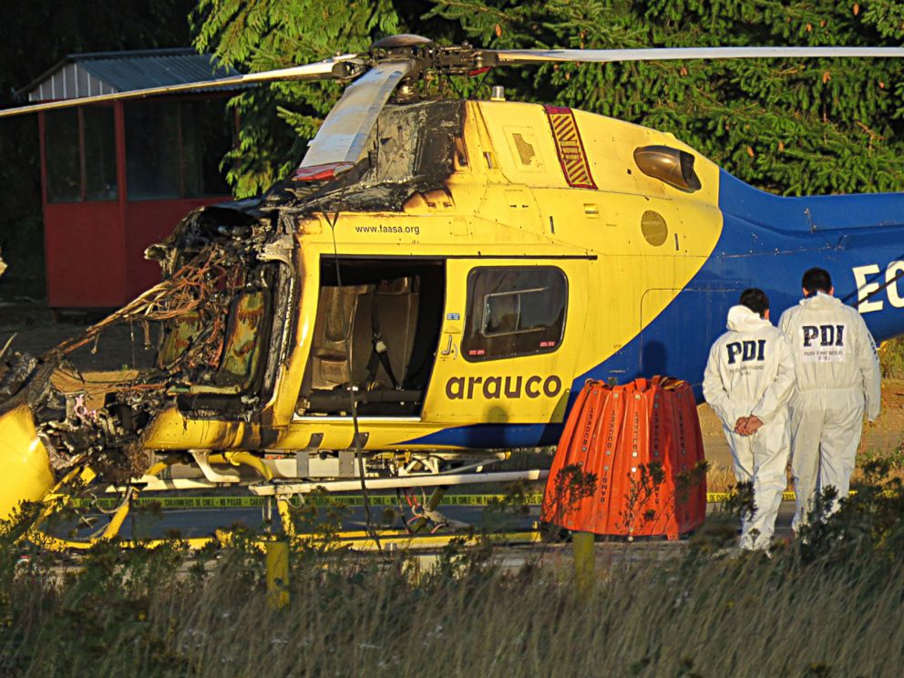 PHOTO: Chilean Investigative Police inspect a helicopter burned at the Arauco Forestry company in Caranilahue, Temuco, Jan. 17, 2018. 