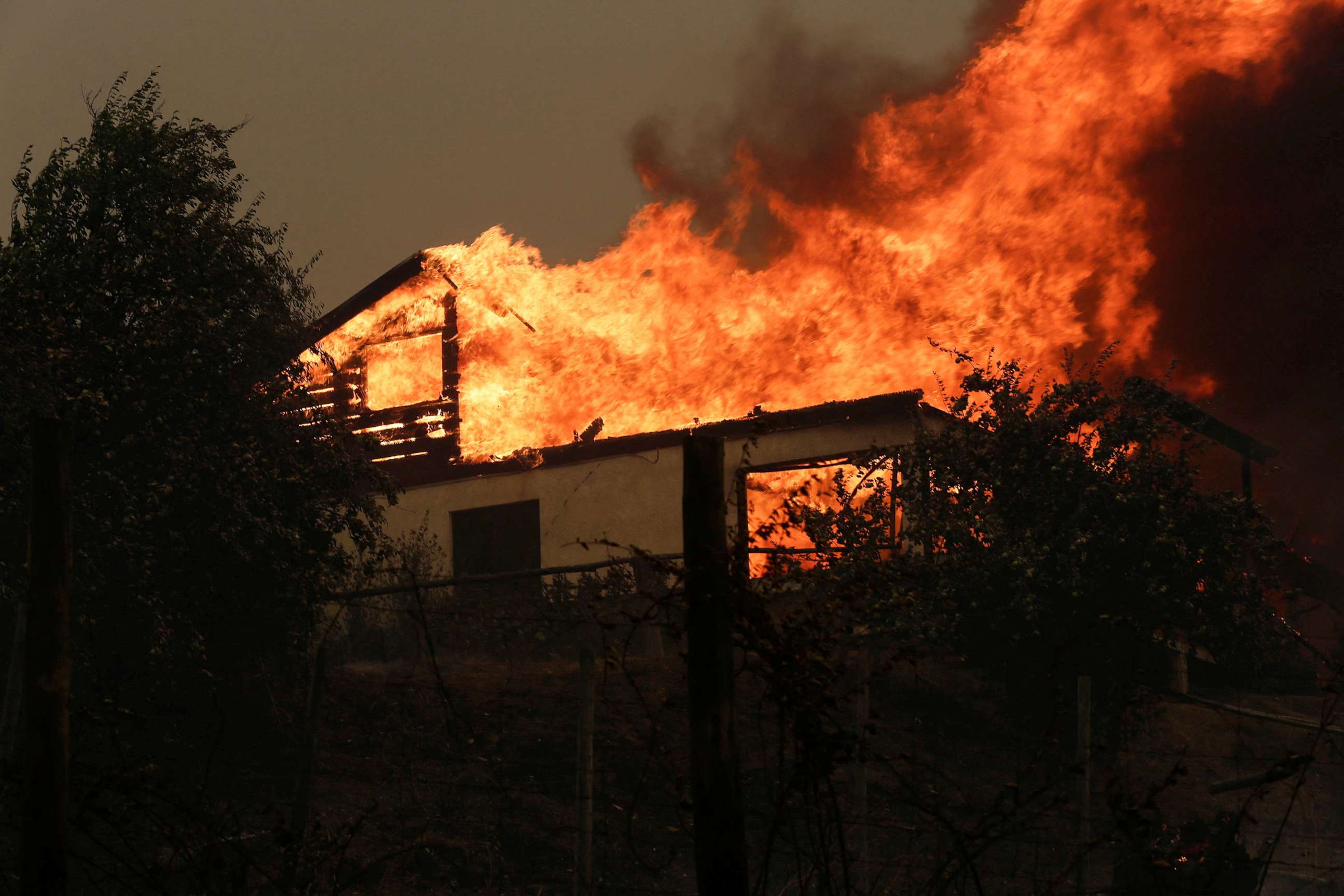 PHOTO: A residence is seen on fire in Santa Juana, near Concepcion, Chile, Feb. 3, 2023.