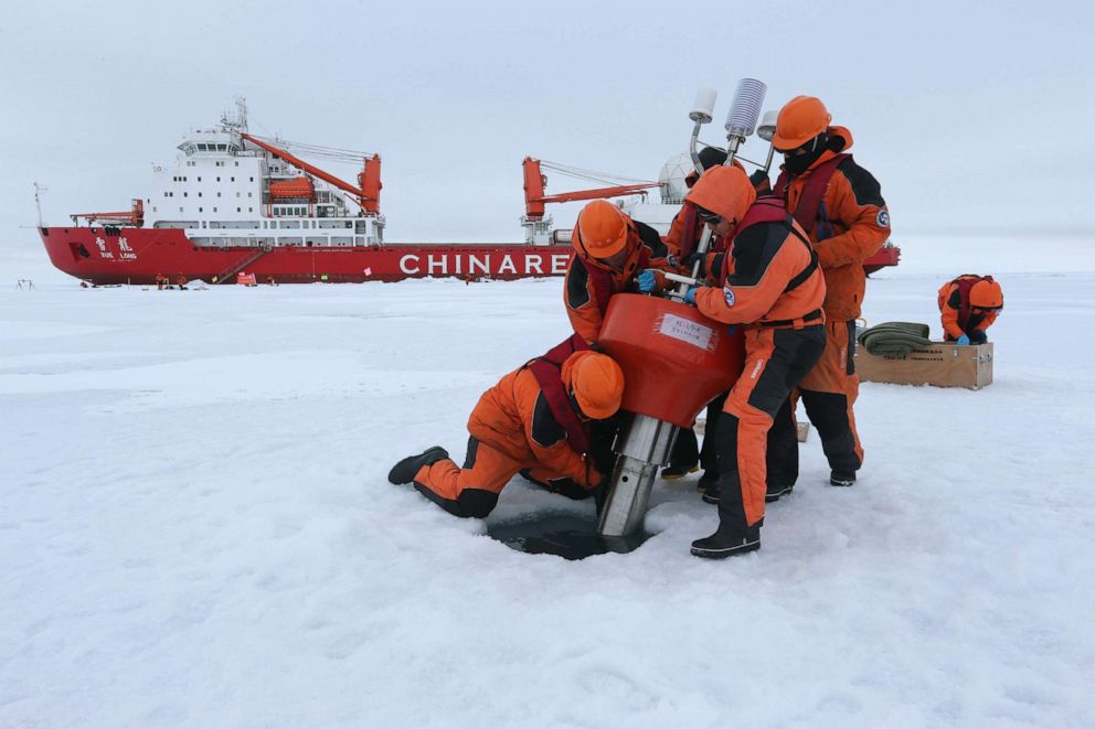 PHOTO: Members of China's research team set up an ocean profiling float at a short-term data acquisition location near the icebreaker Xuelong, or "Snow Dragon", in the Arctic Ocean, Aug. 18, 2016.