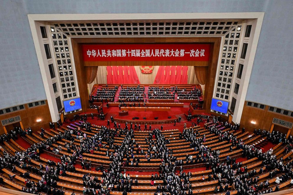 PHOTO: Delegates leave after the opening session of the National People's Congress at the Great Hall of the People in Beijing on March 5, 2023.