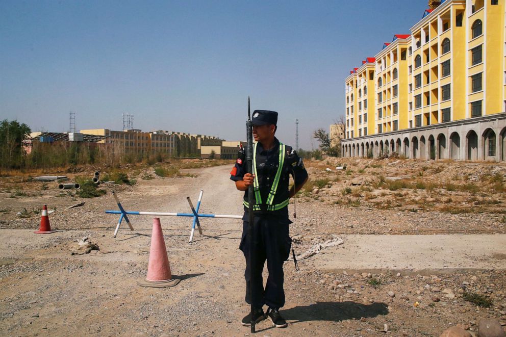 PHOTO: A Chinese police officer takes his position by the road near what is officially called a vocational education centre in Yining in Xinjiang Uighur Autonomous Region, China, Sept. 4, 2018. 