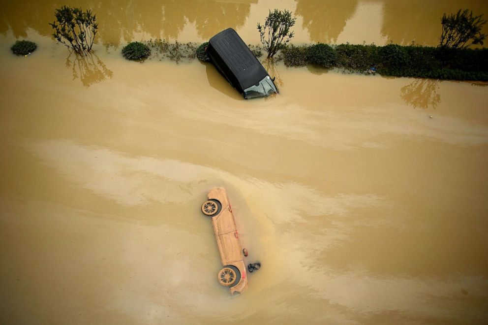 PHOTO: Cars sit in floodwaters following heavy rains, in Zhengzhou, China, July 22, 2021.