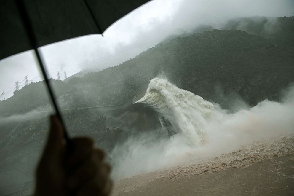 PHOTO: Water is released as heavy rain falls at a massive Pubugou Dam on the Dadu river, a tributary of the Yangtze River in Hanyuan County of Sichuan province, China, Aug. 3, 2018.