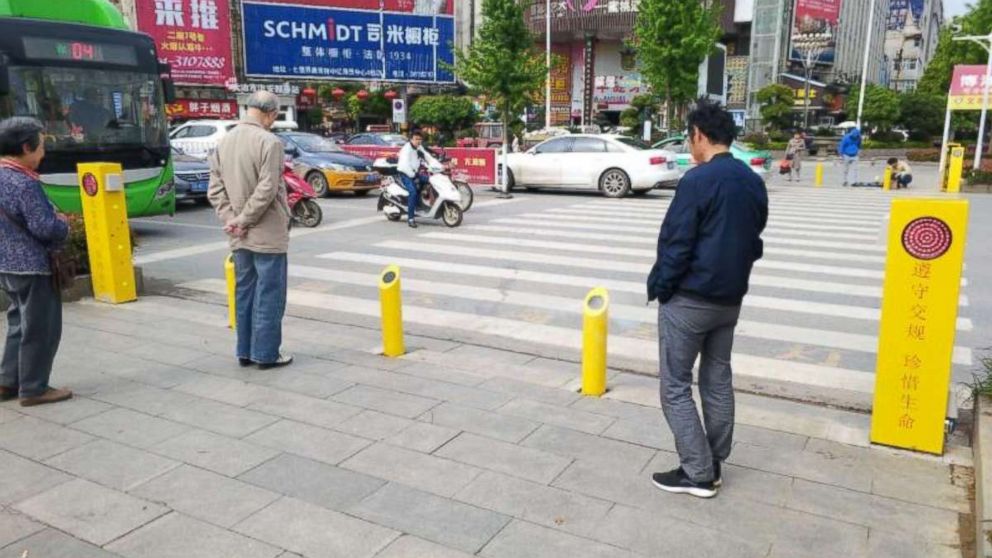 Jaywalkers risk being sprayed with water from posts if they try to cross too soon in Hubei province in central China.