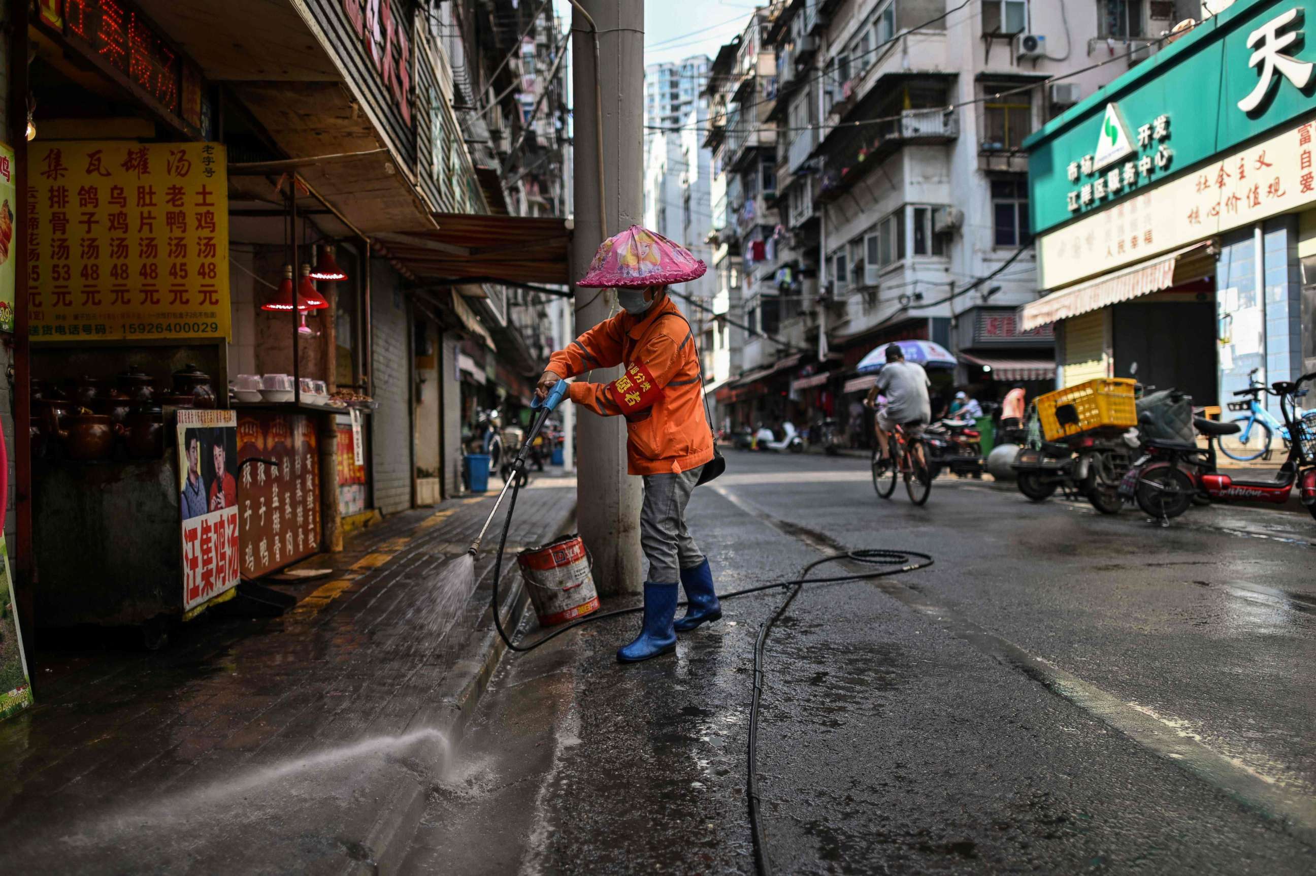 PHOTO: In this photo taken on Sept. 4, 2020, a worker cleans a street along a market in Wuhan, China's central Hubei province.