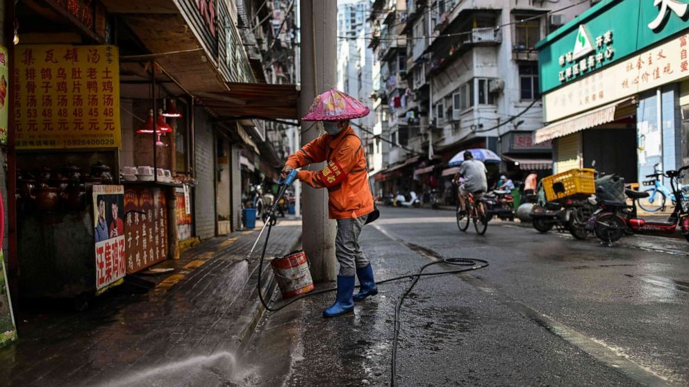 PHOTO: In this photo taken on Sept. 4, 2020, a worker cleans a street along a market in Wuhan, China's central Hubei province.