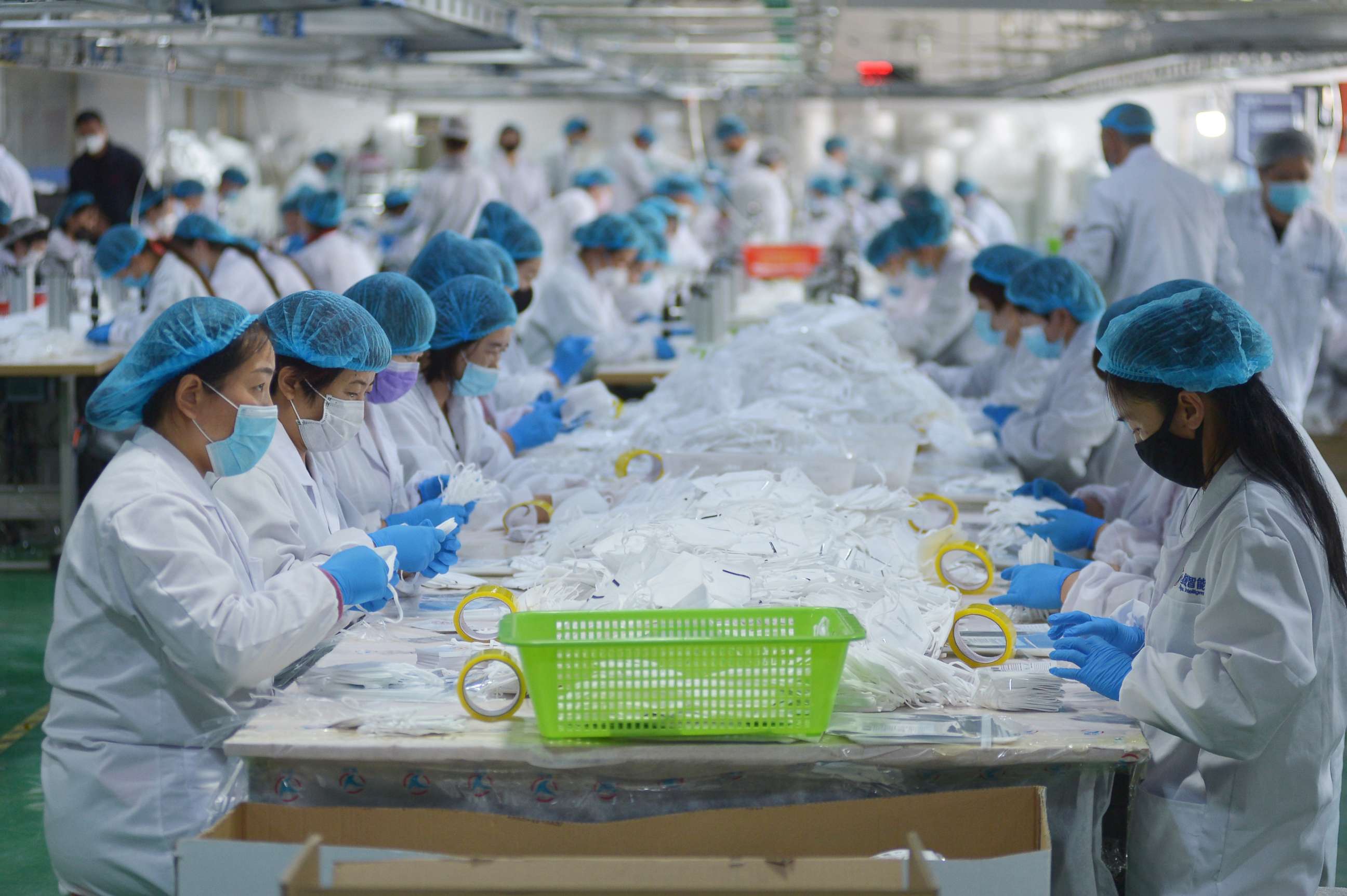 PHOTO: Workers make face masks in a company in Qingdao in east China's Shandong province Monday, April 27, 2020.