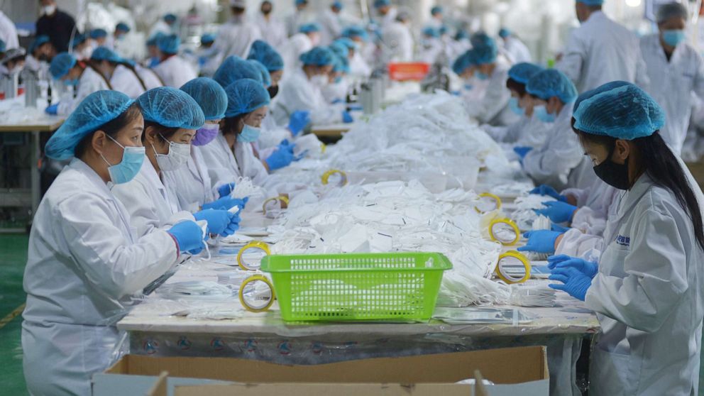 PHOTO: Workers make face masks in a company in Qingdao in east China's Shandong province Monday, April 27, 2020.