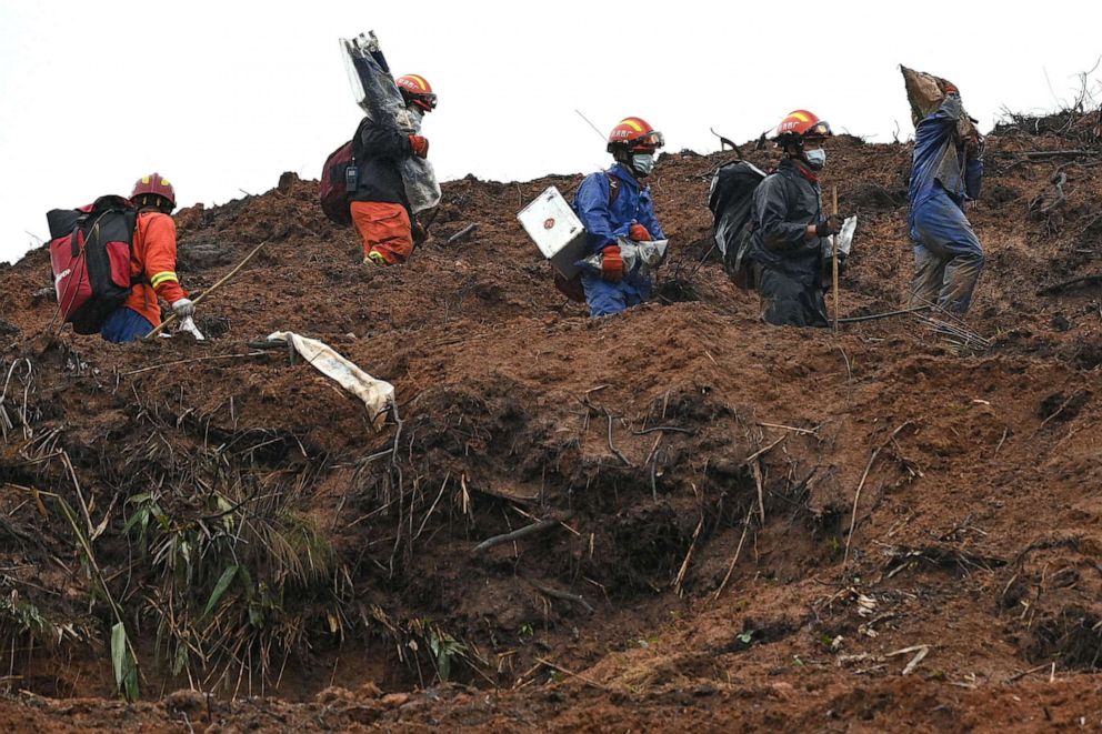 PHOTO: Rescue workers comb through the site of the March 21 China Eastern flight MU5375 crash, near Wuzhou in southwestern China's Guangxi province on March 24, 2022.