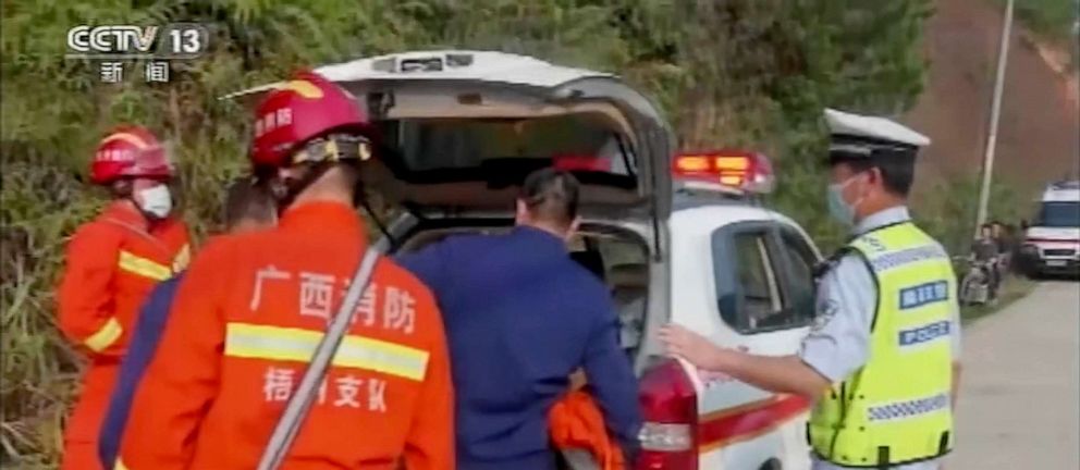 PHOTO: In this image taken from video footage run by China's CCTV, emergency personnel travel to the site of a plane crash near Wuzhou in southwestern China's Guangxi Zhuang Autonomous Region, March 21, 2022.