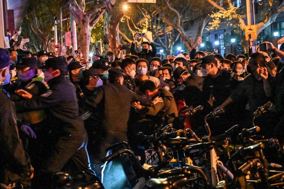 PHOTO: Police arrest a man during protests, Nov. 27, 2022, in Shanghai. 