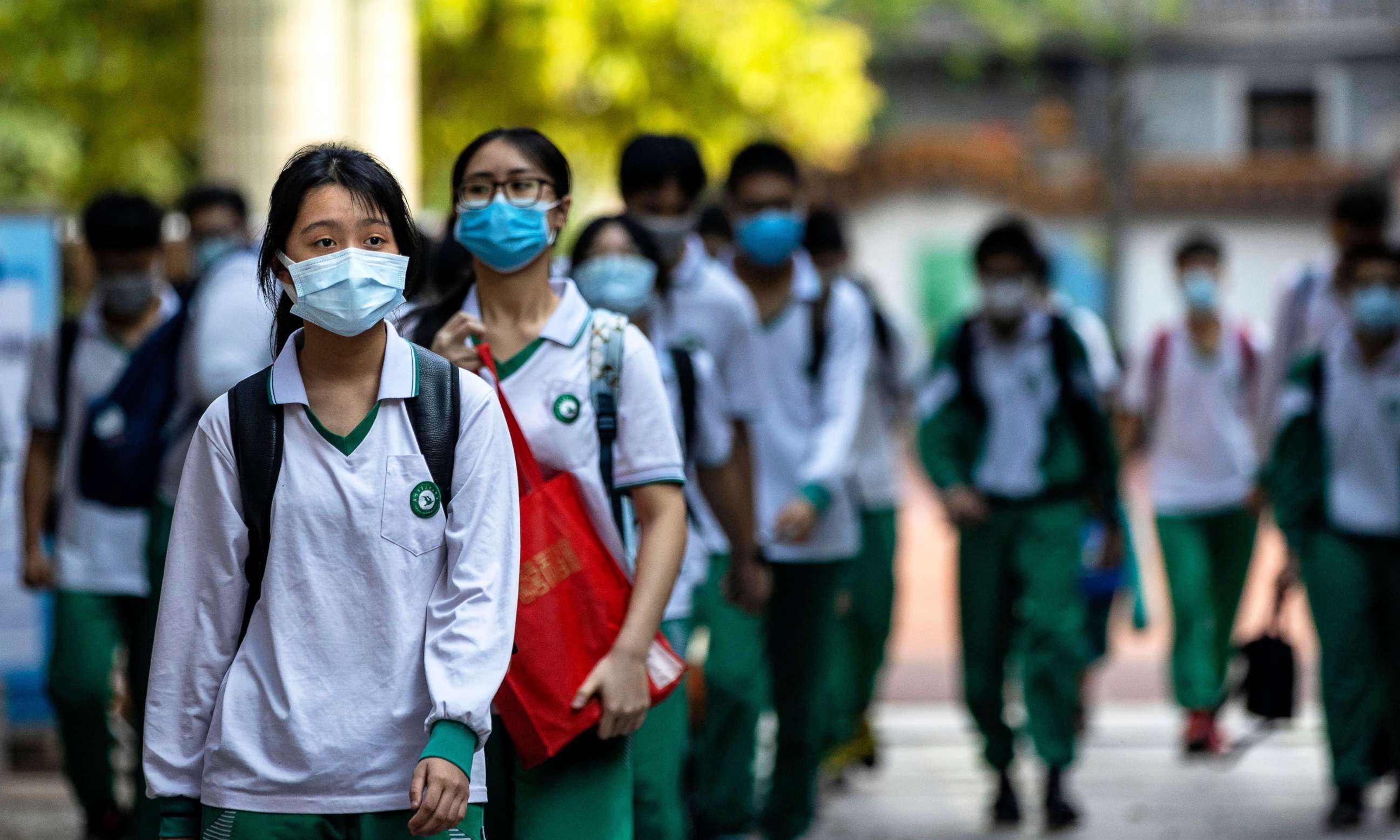 PHOTO: Students enter the Nanwu school in Guangzhou, China, April 17, 2020, amid the ongoing coronavirus COVID-19 pandemic.