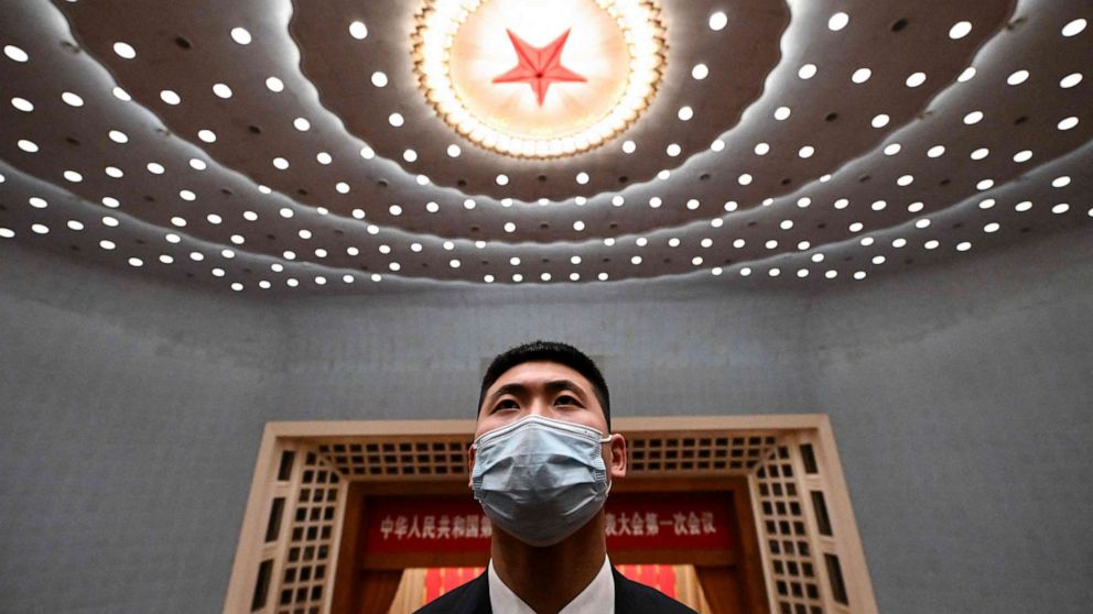 PHOTO: A security officer stands guard after the opening session of the National People's Congress at the Great Hall of the People in Beijing on March 5, 2023.