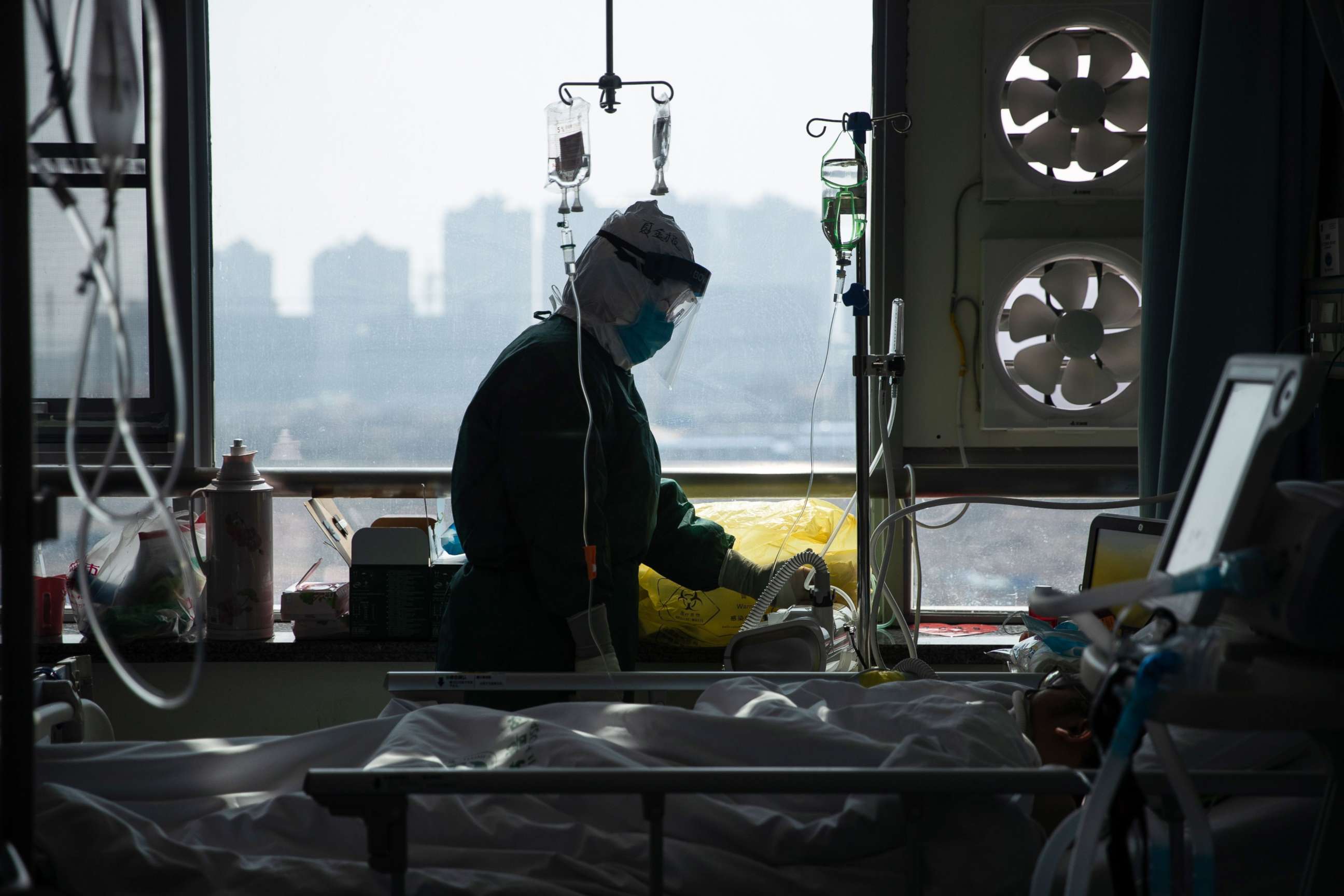 PHOTO: This photo taken on Feb. 22, 2020, shows a medical staff member treating a patient infected by the novel coronavirus at a hospital in Wuhan in China's central Hubei province.