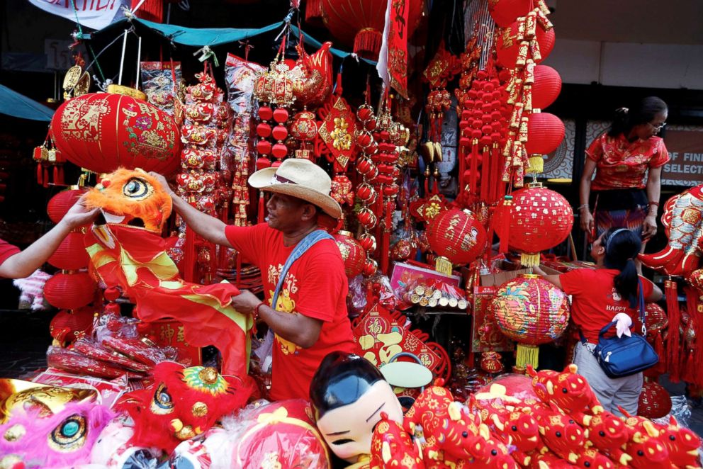 PHOTO: A man sells souvenirs in Chinatown during the Chinese Lunar New Year in Bangkok, Feb .5, 2019.