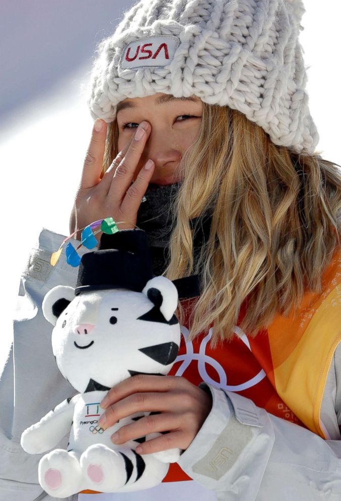 PHOTO: Chloe Kim, of the U.S., wipes away a tear after winning gold in the women's halfpipe finals at Phoenix Snow Park at the 2018 Winter Olympics in Pyeongchang, South Korea, Feb. 13, 2018. 