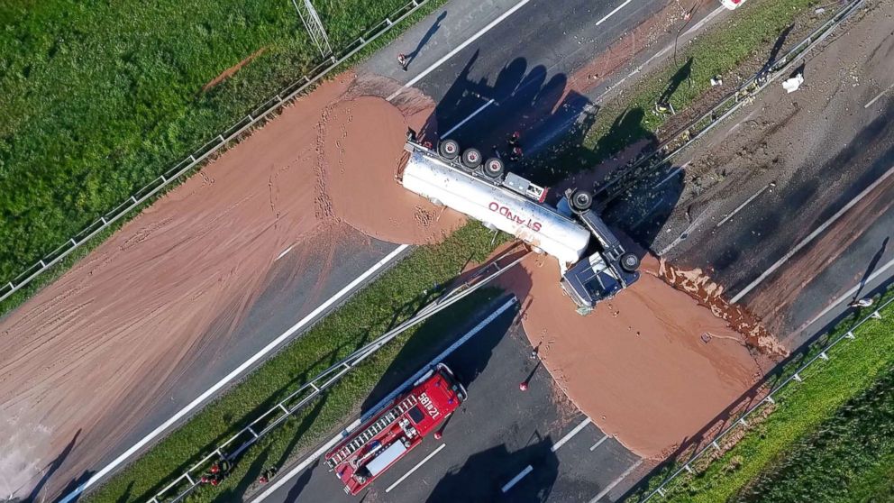 PHOTO: This video grab taken from Polish private TVN channel shows hot chocolate poured out over the A2 highway between Wrzesnia and Slupca near Poznan, western Poland, on May 9, 2018.