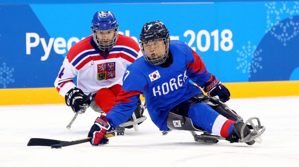 PHOTO: Hyouk Kwang Choi of Korea battles for the puck with Zdenek Safranek of Czech Republic in the ice hockey preliminary round - group B game during day two of the PyeongChang 2018 Paralympic Games on March 10, 2018, in Gangneung, South Korea.