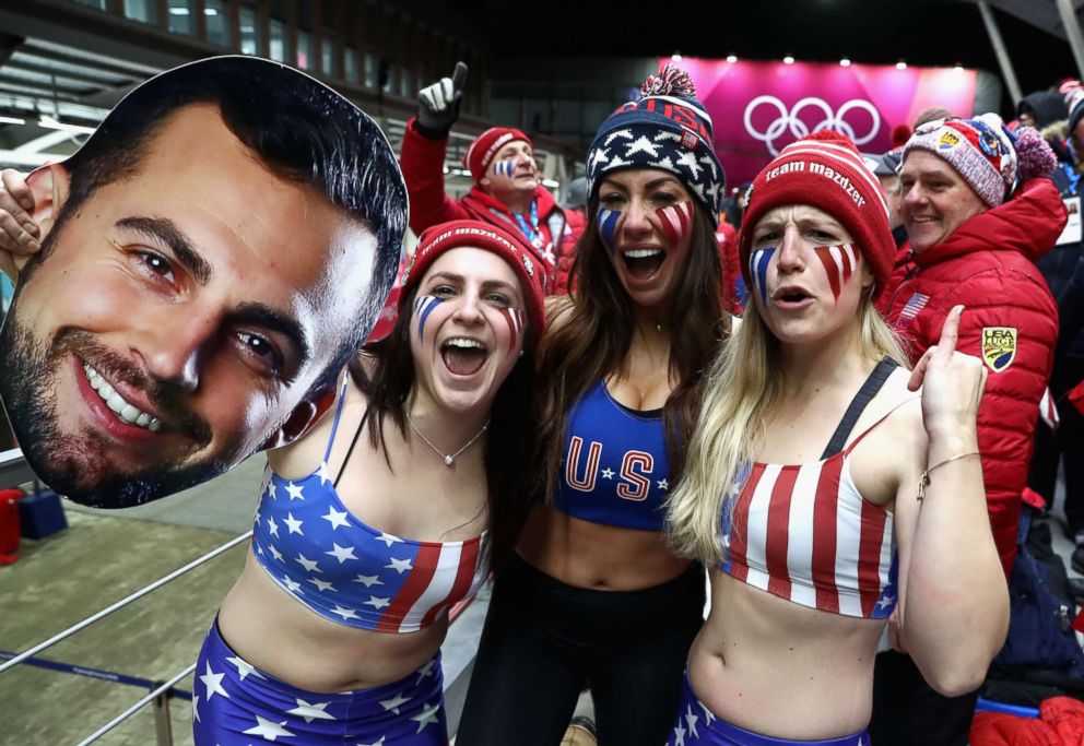 PHOTO: Fans of Chris Mazdzer of the U.S. including his girlfriend Mara Marian (C) react following his third run during the luge men's singles on day two of the Pyeongchang 2018 Winter Olympic Games, Feb. 11, 2018, in Pyeongchang-gun, South Korea. 