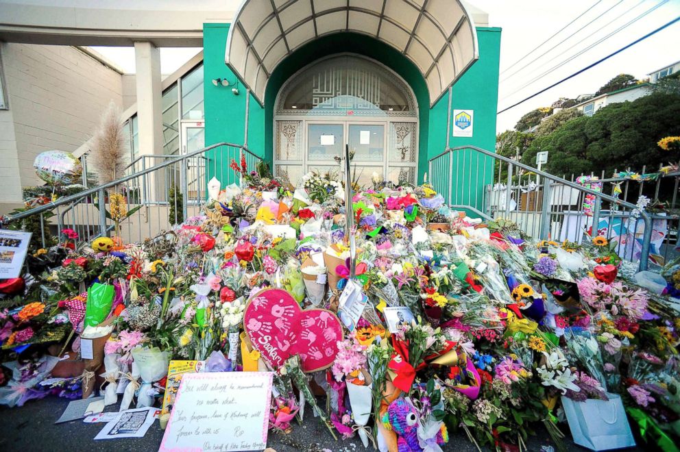 PHOTO: Flowers left by residents are seen at a memorial site for victims of the Christchurch mosque attacks at an Islamic Center in Kilbirnie, Wellington, New Zealand, March 19, 2019.