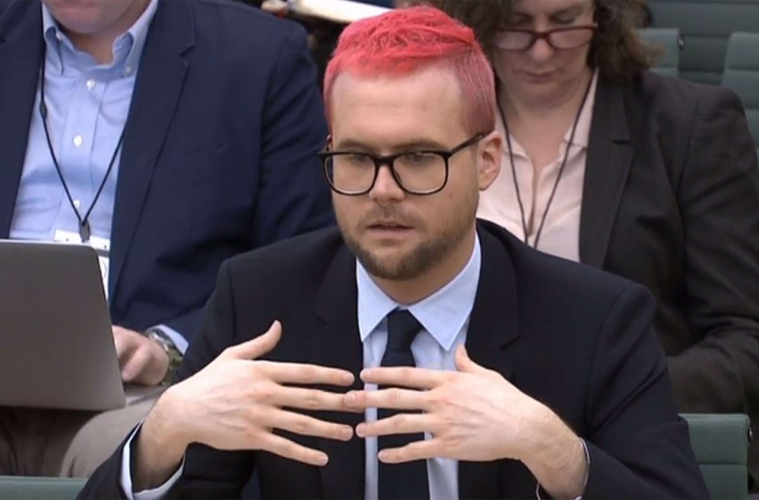 PHOTO: Christopher Wylie appears as a witness before the Digital, Culture, Media and Sport Committee of members of the British parliament at the Houses of Parliament in central London on March 27, 2018.