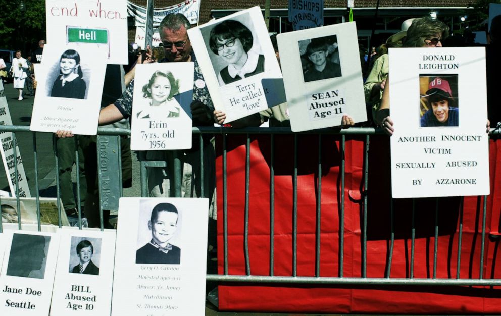 PHOTO: Protesters hold photos of alleged victims of sexual abuse outside the Cathedral of the Holy Cross during the installment of Sean Patrick O'Malley as the new Roman Catholic Archbishop of the Boston Archdiocese, July 30, 2003, in Boston.