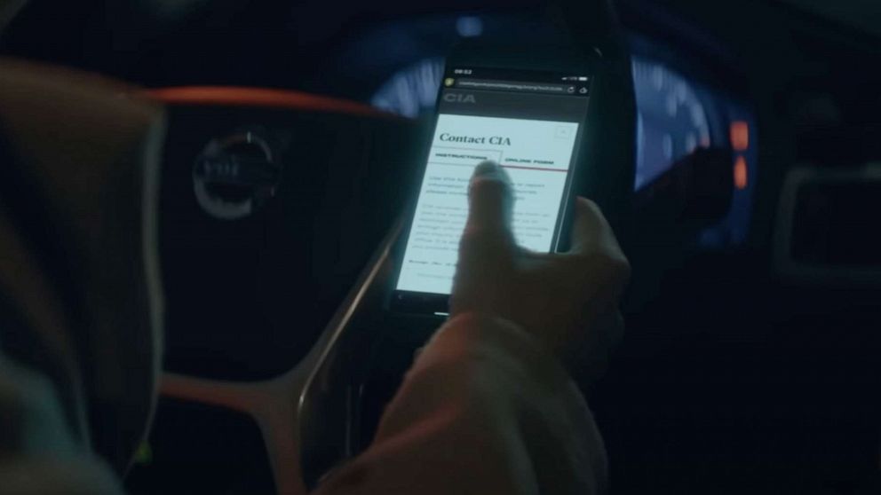 PHOTO: In a still from a Central Intelligence Agency video aimed at recruiting Russians spies, someone is shown contacting the CIA on their phone.