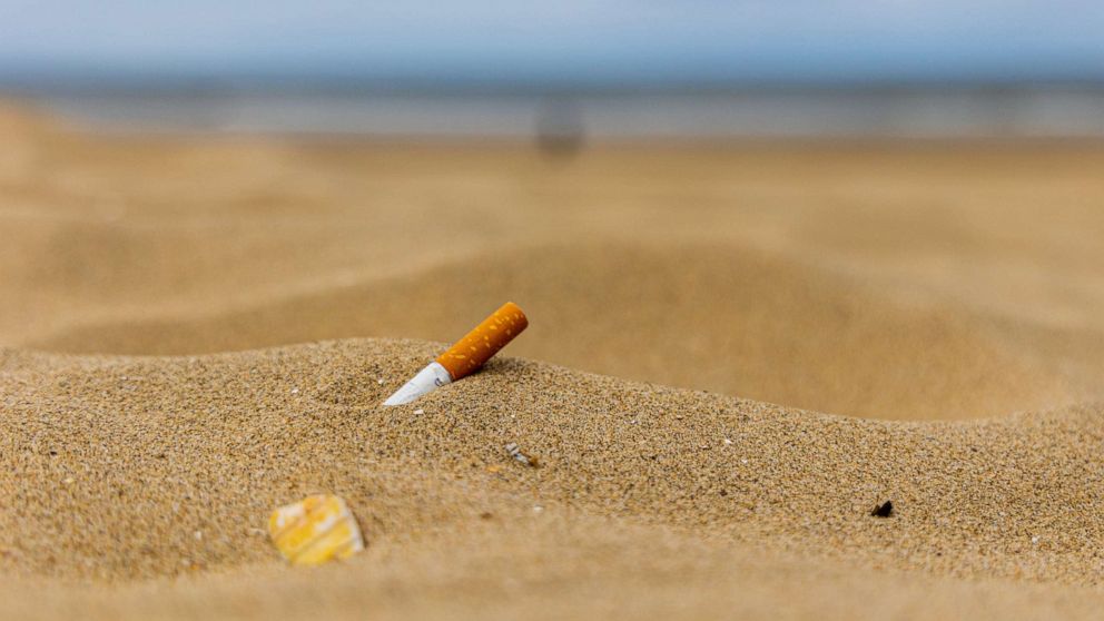 PHOTO: In this undated stock photo, a cigarette butt is shown in the sand on a beach.