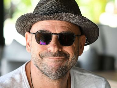 PHOTO: In this file photo taken on July 19, 2019, Guy Laliberte, co-founder of global circus company Cirque du Soleil, poses for a photo on his private island of Nuketepipi in French Polynesia.