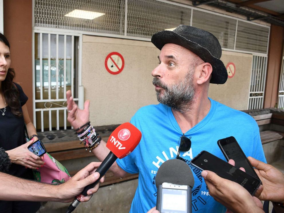PHOTO: Guy Laliberte, billionaire co-founder of global circus company Cirque du Soleil, speaks to the press while Anne Dongois, communication director of Lune Rouge, listens on, as they leave the courthouse of Papeete, French Polynesia, on Nov. 13, 2019.