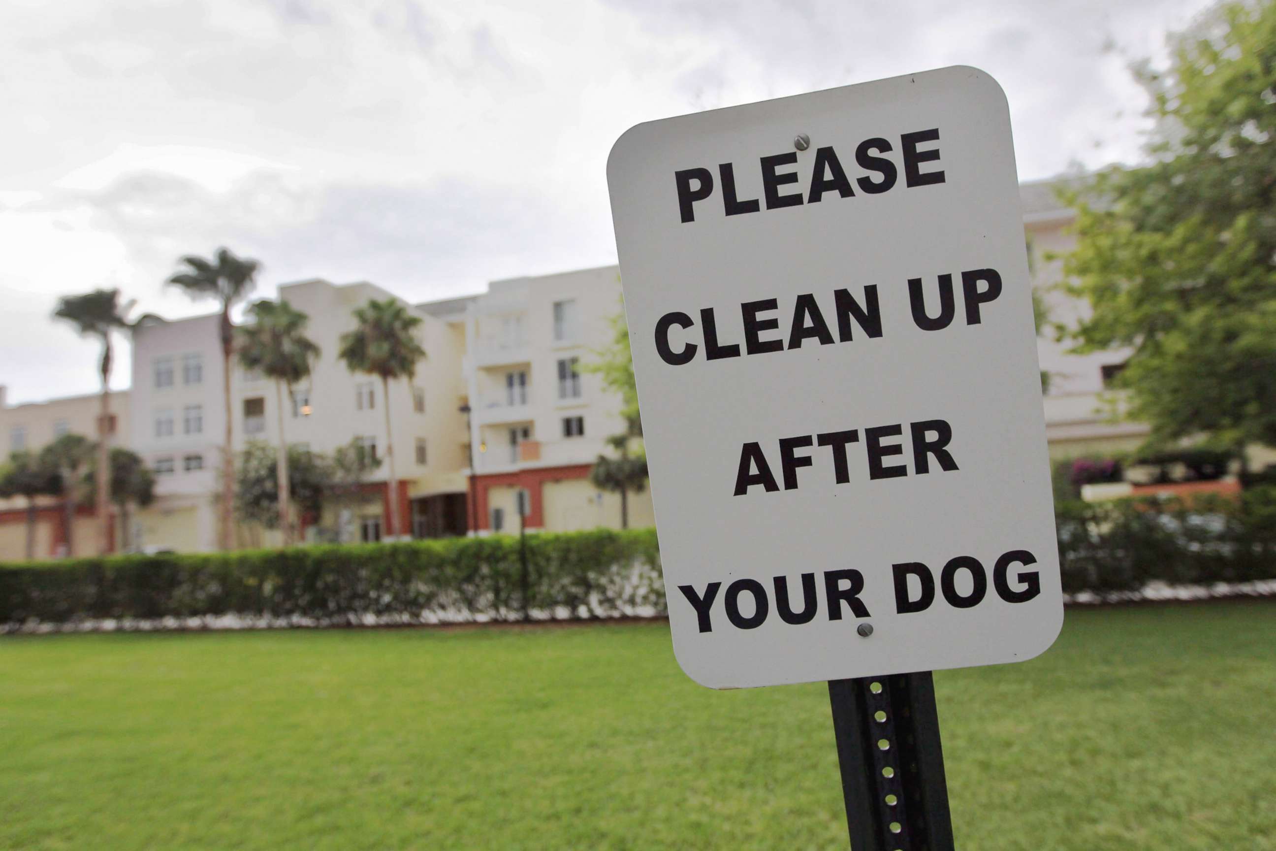 PHOTO: A sign is posted reading, " Please clean up after your dog"' in The Village of Abacoa condominium complex in this June 30, 2011 file photo in Jupiter, Fla.