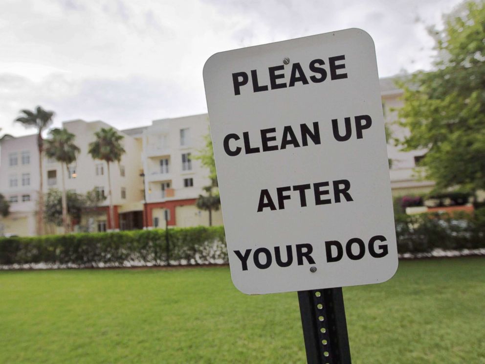 PHOTO: A sign is posted reading, Please clean up after your dog in The Village of Abacoa condominium complex in this June 30, 2011 file photo in Jupiter, Fla.