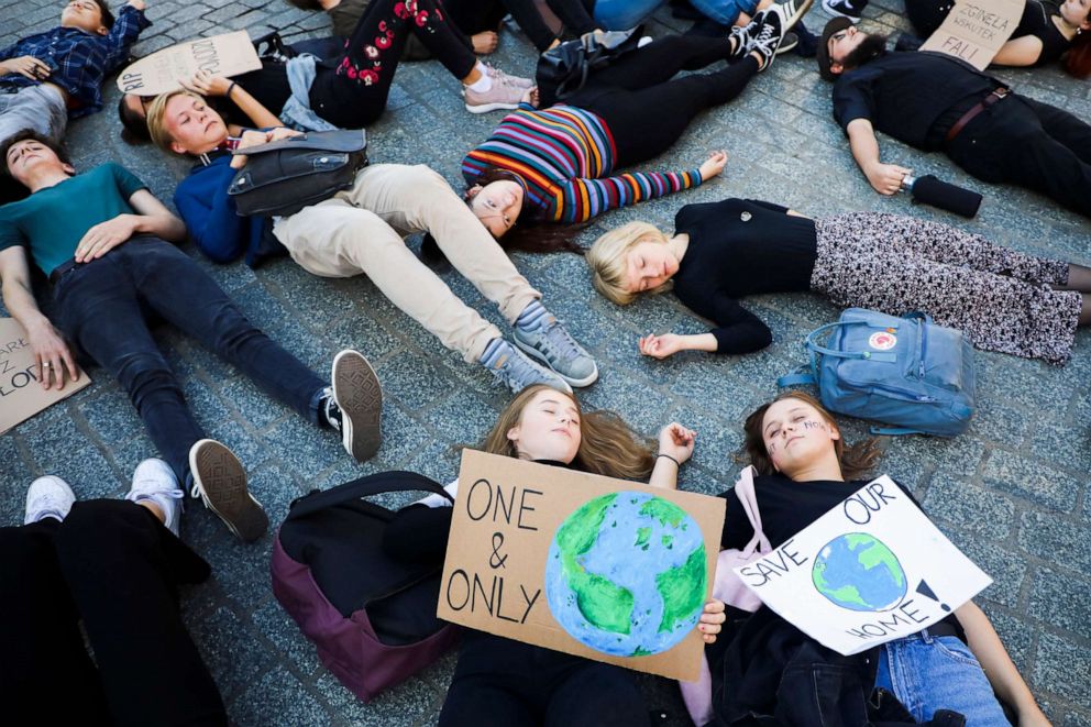 PHOTO: Young people attend 'Die-In' protest during Global Climate Strike to demand action be taken on climate change in Krakow, Poland, Oct. 14, 2019. 