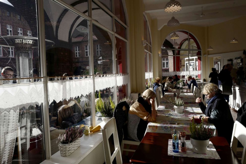 PHOTO: People spend time at Cafe Byfyj in Nikiszowiec district in Katowice, Poland, Oct. 24, 2018.