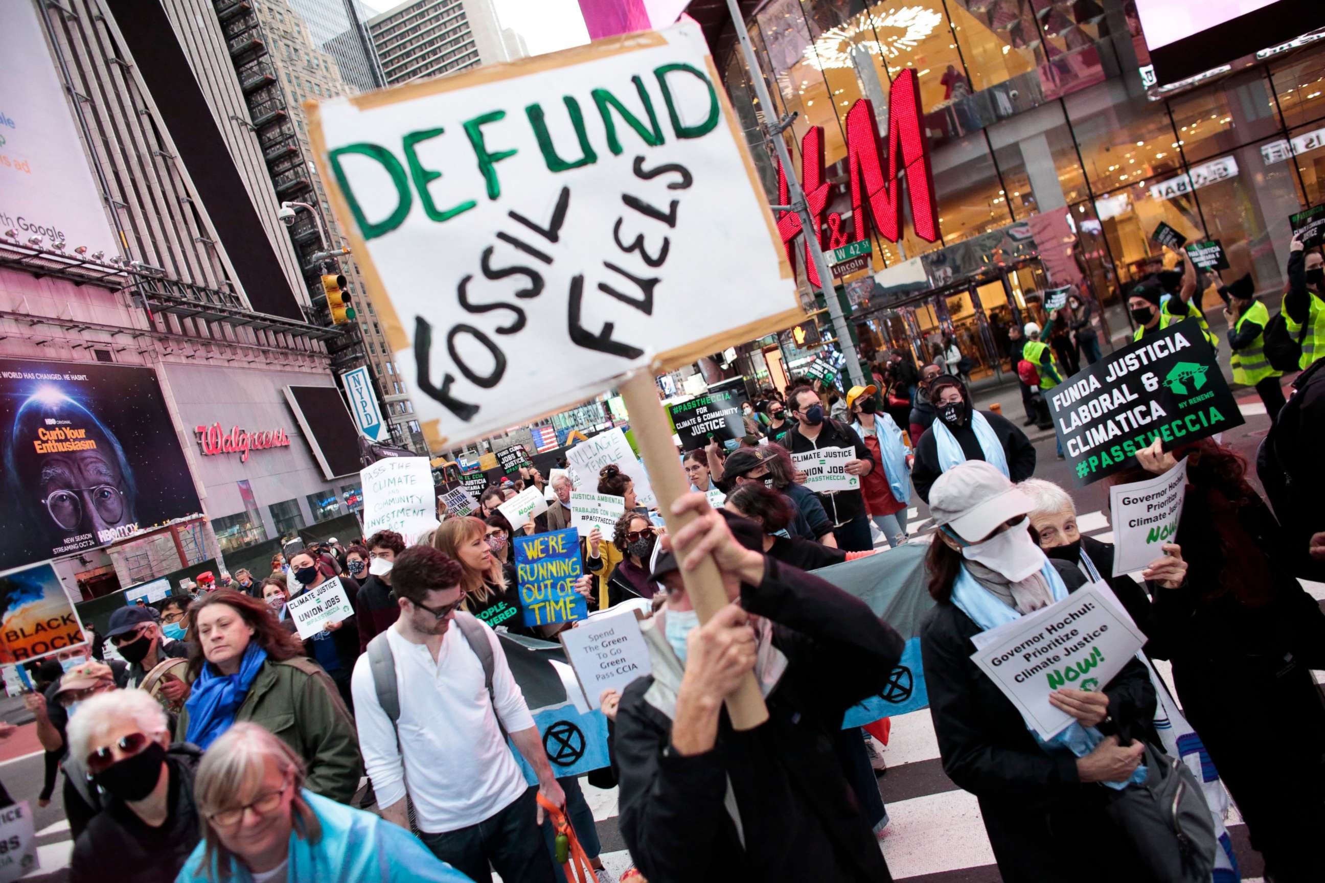 PHOTO: People attend the Climate Justice March as they protest from Times Square to Governor Hochul's Manhattan office in New York, November 13, 2021.