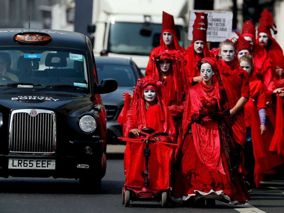 PHOTO: Members of the Red Brigade march in disobedience on the street from Oxford Circus to Piccadilly Circus in London, April 17, 2019.