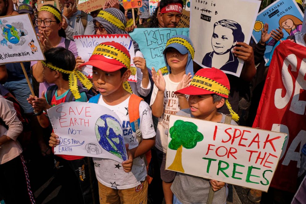 PHOTO: School children participate in a demonstration calling for action on climate change on September 20, 2019, in Jakarta, Indonesia.