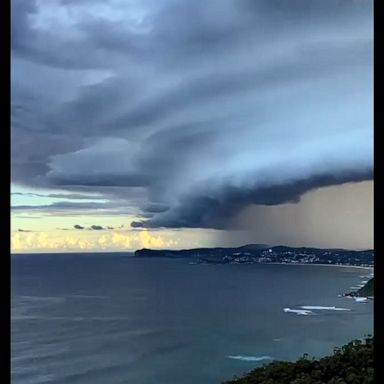 Storm clouds swept over the New South Wales coast, as Australia's southeast sees heavy rain.